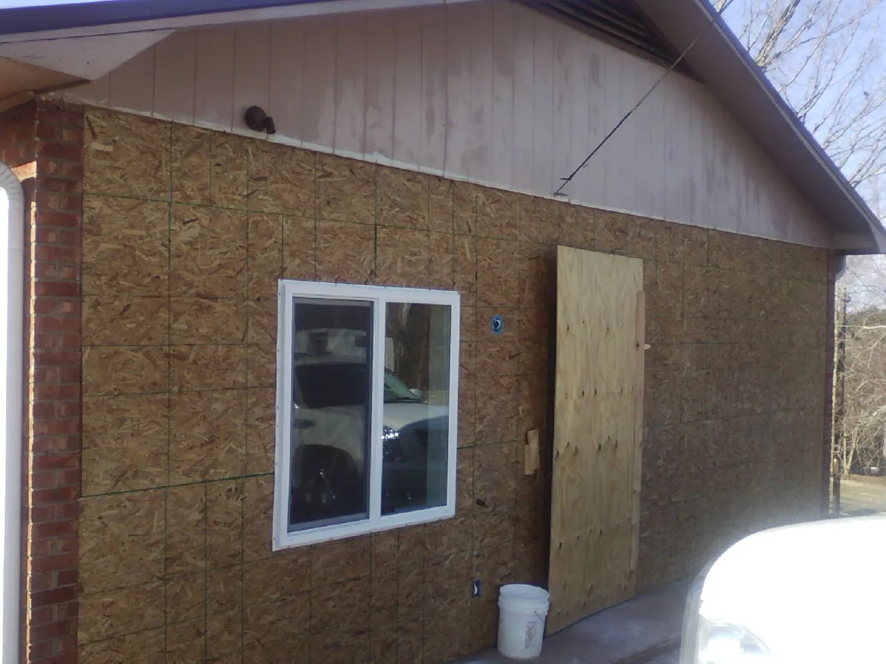 OSB sheathing on a garage addition wall before siding in El Dorado